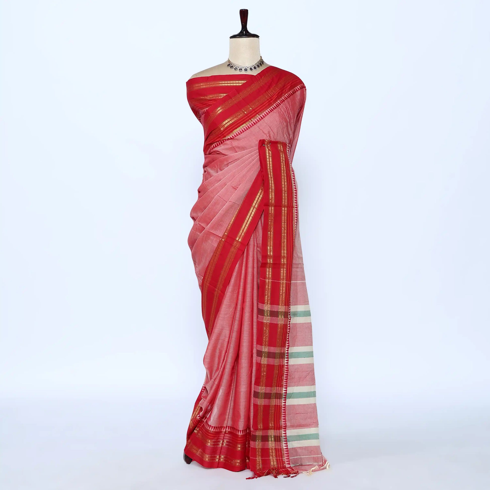 A pink and red saree with gold and green stripes