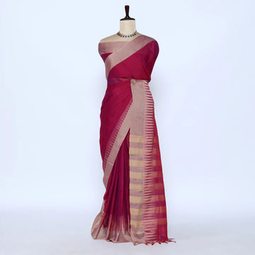 Deep magenta and beige striped saree detail showcasing woven texture and elegant striped pattern