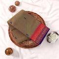 Kanchi Cotton Saree With Olive Green Body Pink Purple Zari Border And Woven Motifs Folded Flat Lay View
