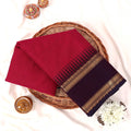 Kanchi Cotton Saree With Gold Zari Border In Deep Pink And Purple Folded On Basket Top View Display
