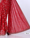 Red designer saree with a matching blouse  featuring silver floral embroidery and a scalloped border