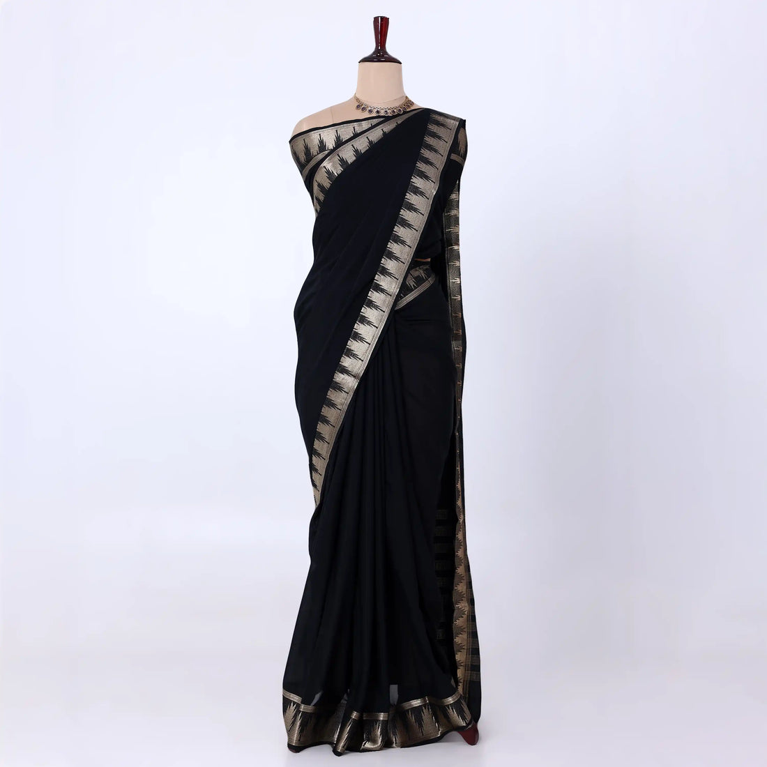 Mysore Silk saree with plain black body and golden zari woven border, front drape view