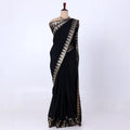 Mysore Silk saree with plain black body and golden zari woven border, front drape view