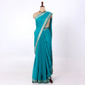 Mysore Silk saree with plain turquoise blue body and silver zari woven border, front drape view
