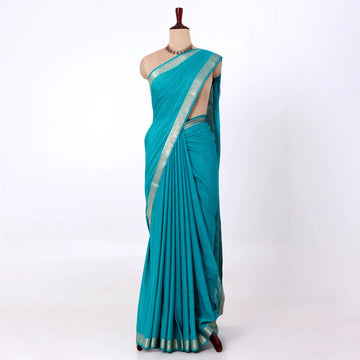 Mysore Silk saree with plain turquoise blue body and silver zari woven border, front drape view