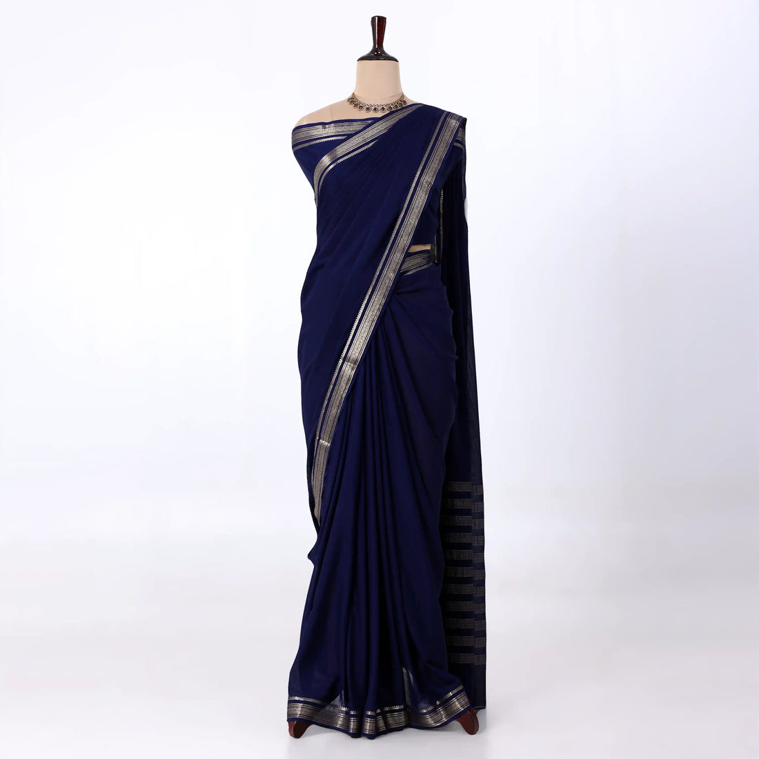 Mysore Silk saree with plain navy blue body and golden zari woven border, front drape view
