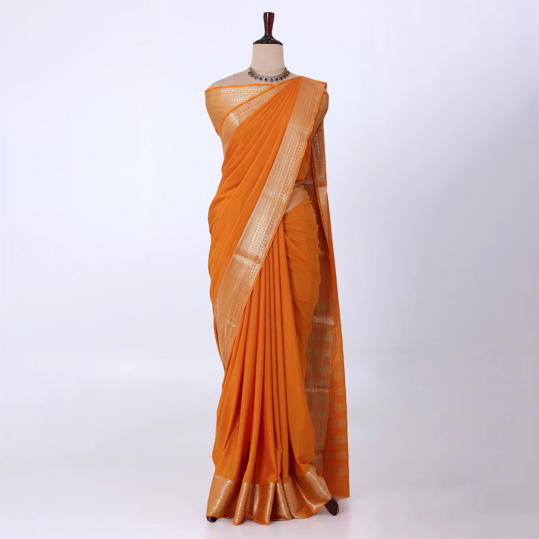 Mysore Silk saree with plain dark yellow body and golden zari woven border, front drape view