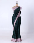 A dark green and light pink saree 