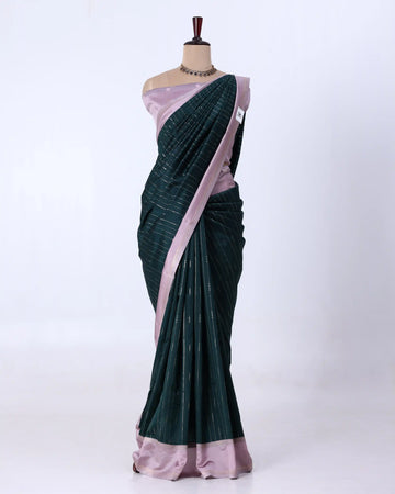 A dark green and light pink saree 