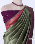 A draped olive green saree with a deep purple blouse, featuring a pink border and a purple pallu