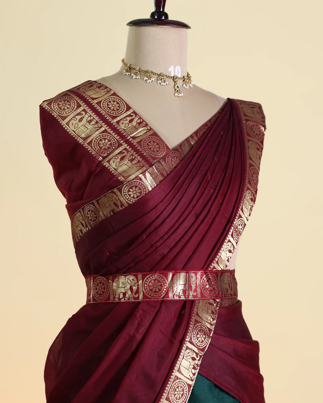 Women’s Semi Stitched Solid Pattern Dhavani Set with Intricate Elephant Zari Border Traditional Woven Skirt and Draped Dupatta - Maroon & Dark Green