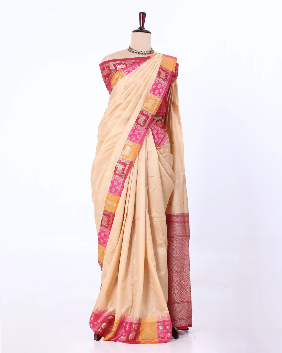 A pink silk saree with a detailed red and gold border