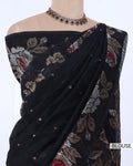 Black saree with beige, red, and white floral embroidery