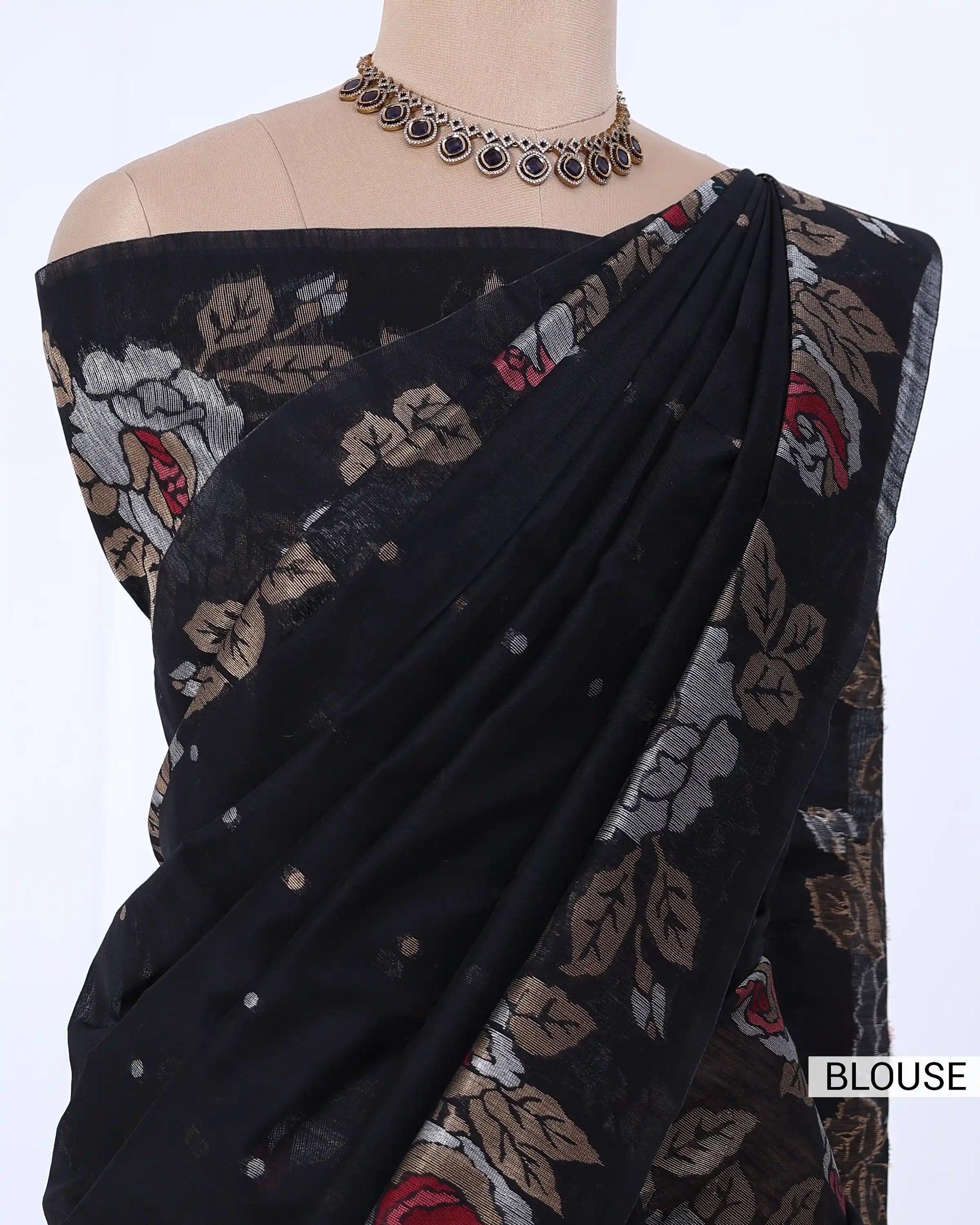 Black saree with beige, red, and white floral embroidery