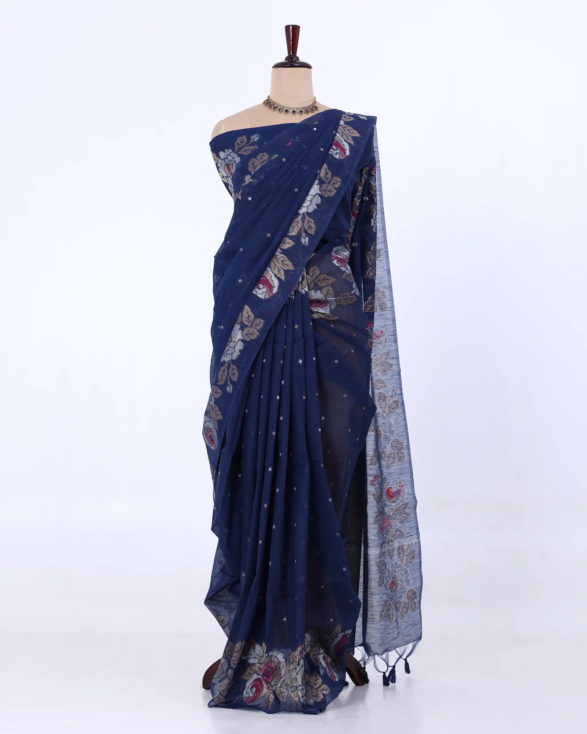A navy blue saree with floral and geometric patterns