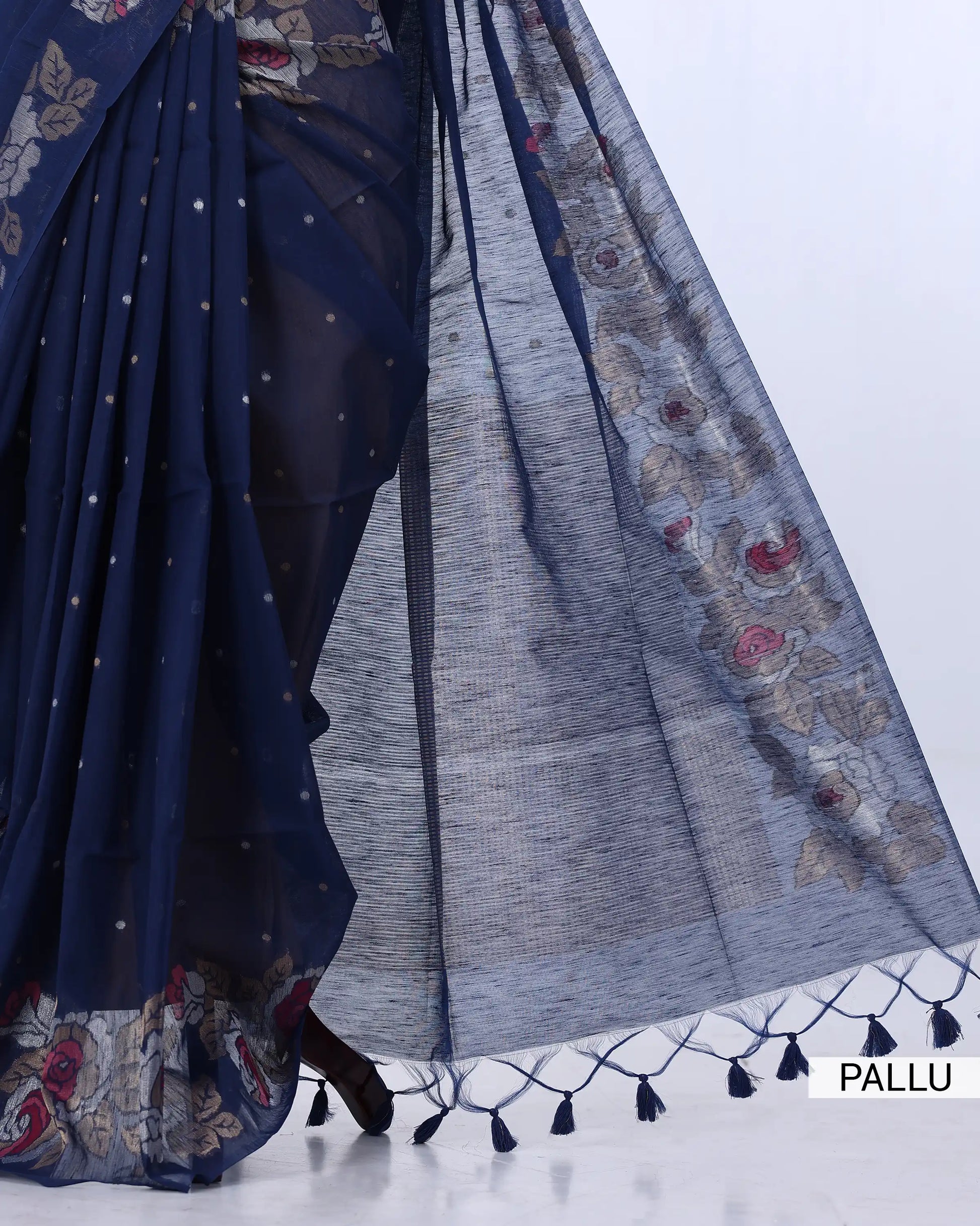 A navy blue saree with floral and geometric patterns