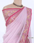A light pink saree  featuring a matching pink blouse with yellow and white woven patterns and a pink border. 