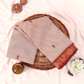 Kanchi Cotton Saree With Red Zari Border And Delicate Woven Motifs In Beige Folded Flat Lay Top View Display
