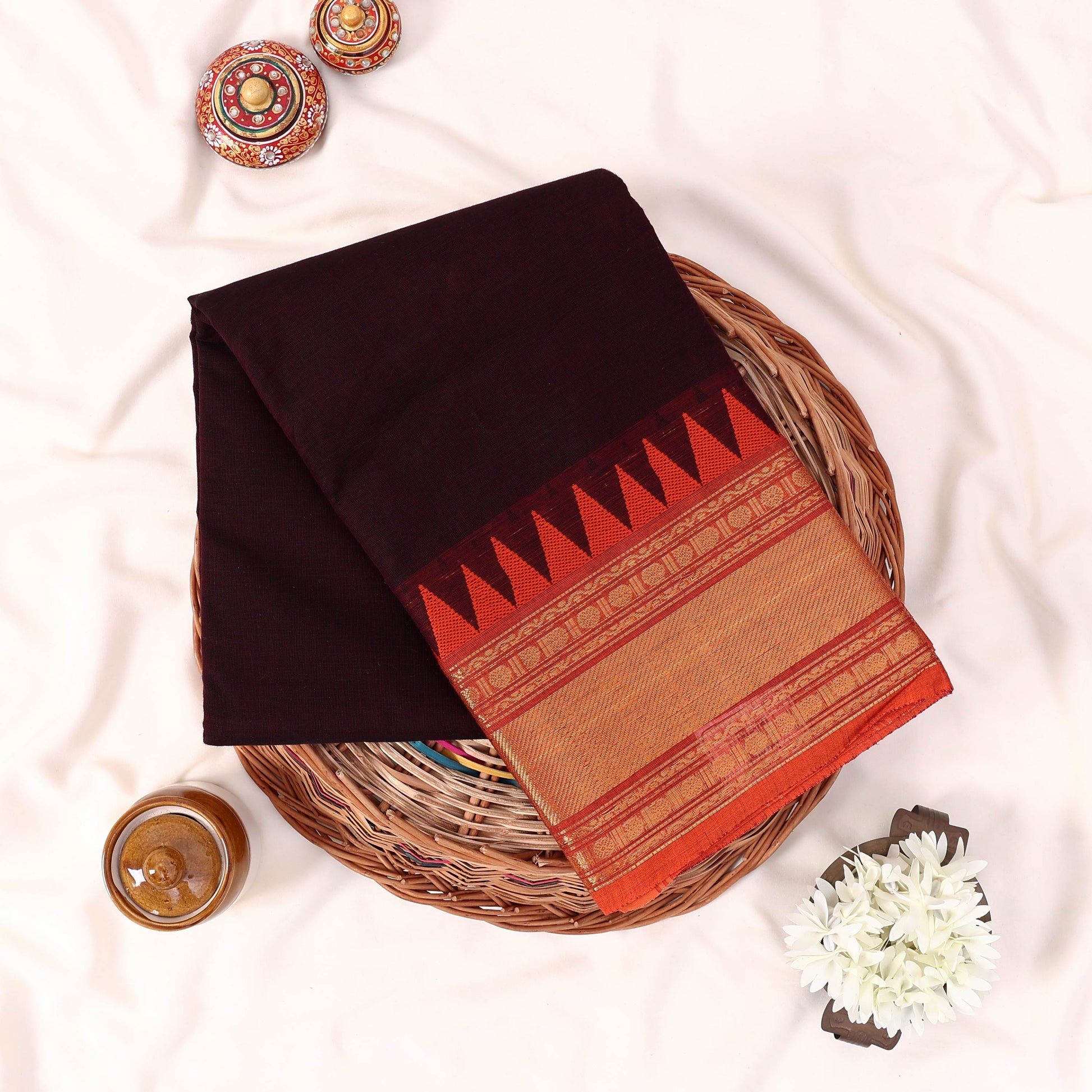 Kanchi Cotton Saree With Gold Zari Border And Red Orange Temple Motif Deep Brown Color Folded Flat Lay View
