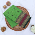Chettinad cotton saree with zari buttas checked body peacock zari border in maroon and green folded top view