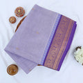Chettinad cotton saree with lavender body gold zari buttas and purple zari woven border folded top view
