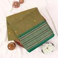 Chettinad cotton saree with light green plain body temple zari border and woven butta motifs folded top view.