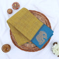 Chettinad cotton saree with gold checked pattern and elephant zari woven border in yellow flat lay view