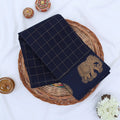 Chettinad cotton saree with gold checked pattern and elephant zari woven border in navy blue flat lay view