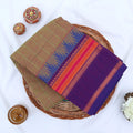 Chettinad cotton saree with olive green checked body and multicolor temple border folded flat lay view