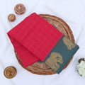 Chettinad cotton saree with elephant zari border and checked body in pink and blue folded top view.