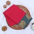 Chettinad cotton saree with elephant zari border and checked body in pink and blue folded top view.