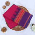 Chettinad cotton saree with striped body and temple zari border in purple and pink folded top view