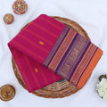 Chettinad cotton saree with zari buttas and temple zari border in Purple and royal Purple folded top view