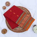 Chettinad cotton saree with zari floral butta striped body peacock border in red folded top view
