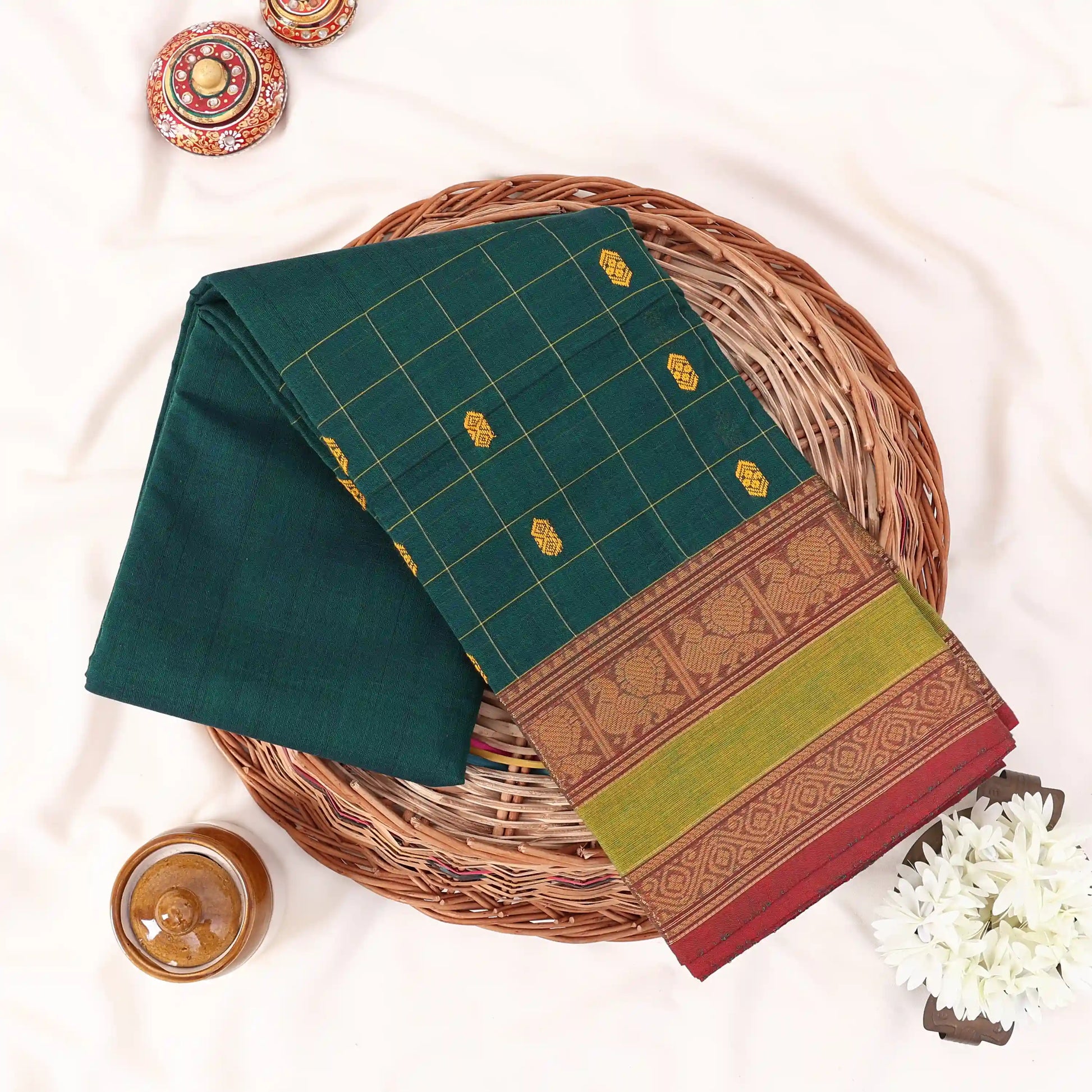 Chettinad cotton saree with zari buttas checked body peacock zari border in teal and green folded top view