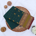 Chettinad cotton saree with zari buttas checked body peacock zari border in teal and green folded top view