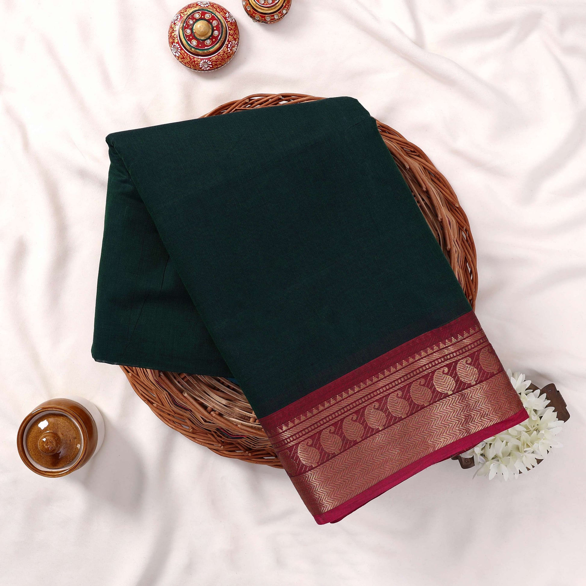 Kanchi Cotton Saree With Dark Green Body And Maroon Gold Zari Border Folded Display Top View
