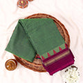 Green Kanchi Cotton Saree With Magenta And Gold Temple Border Folded Display Top View Flat Lay
