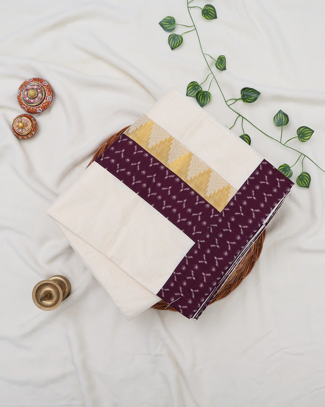 An off-white/cream saree featuring a deep purple border with a white geometric pattern - full view