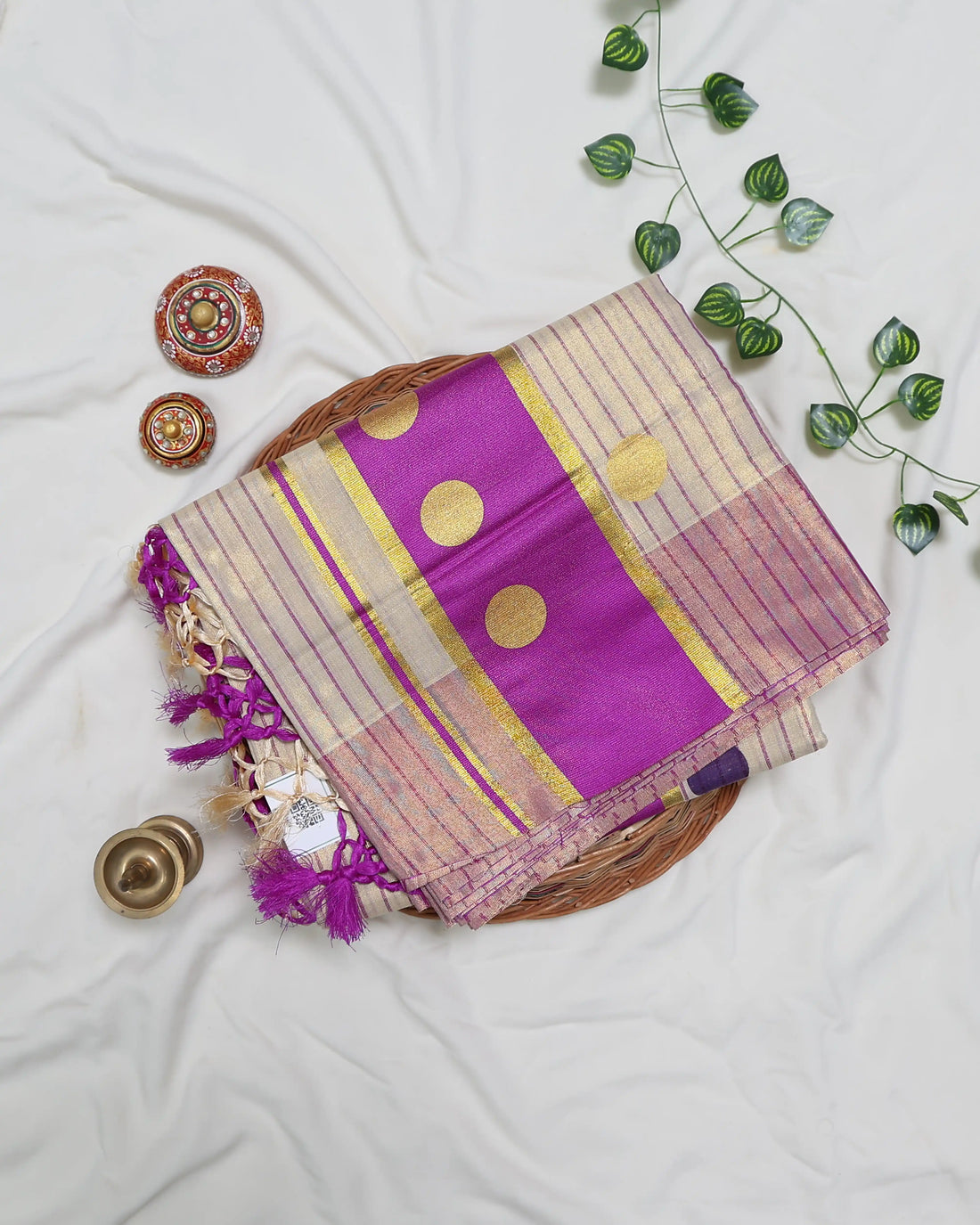A cream and pink striped kerala saree with a matching pink blouse full view