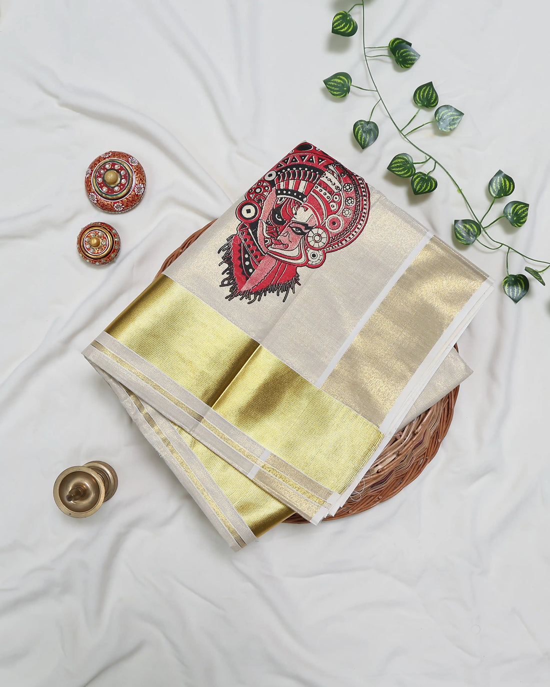 A cream-colored kerala saree with red print full view