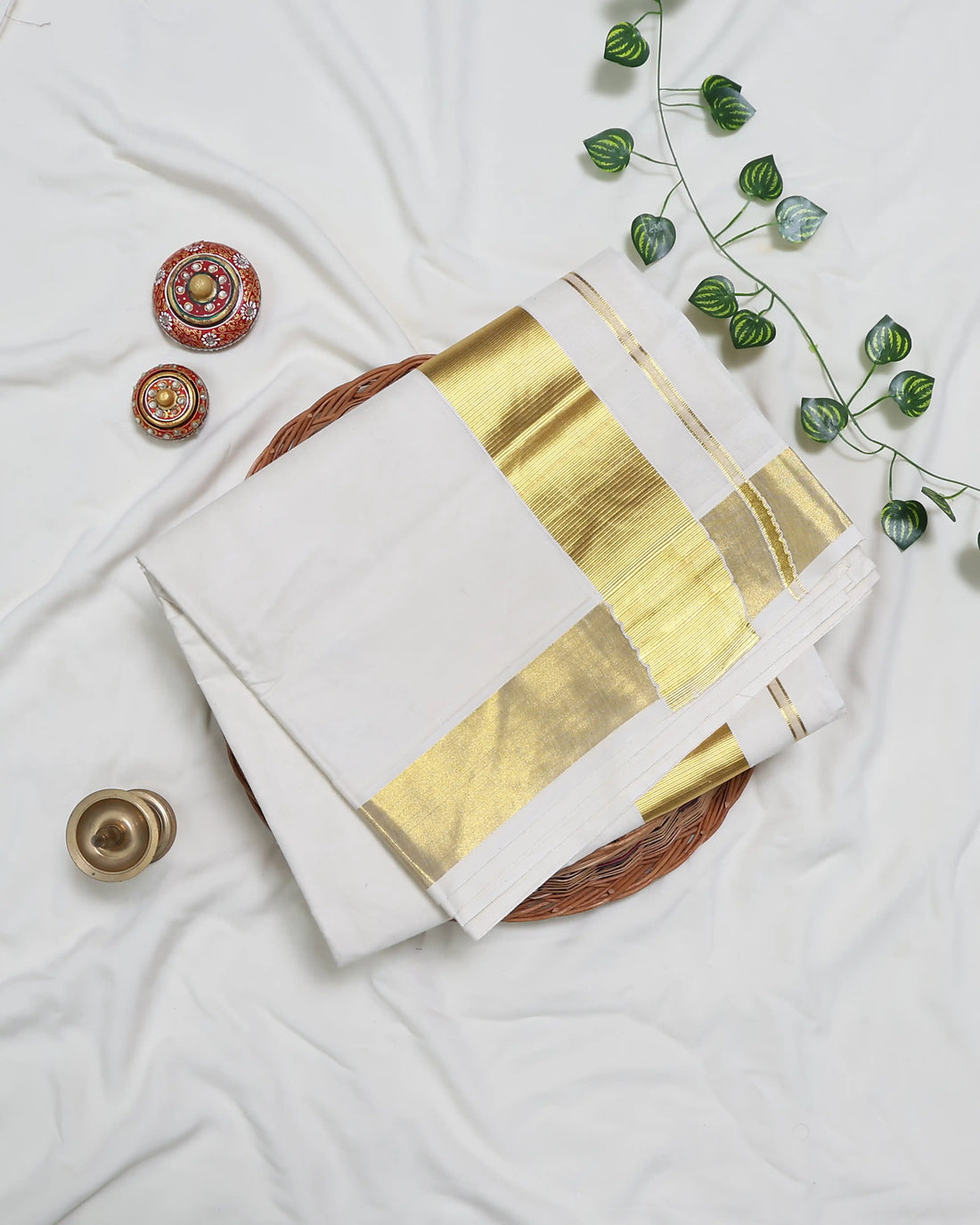 An off-white kerala saree with gold zari embroidery and borders - full view