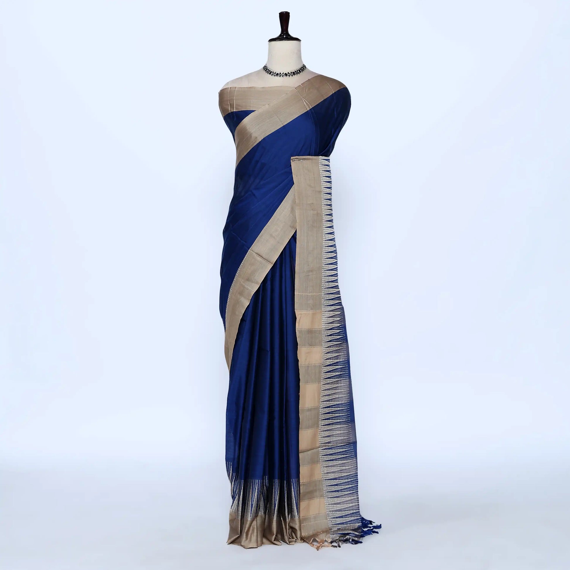 Blue and beige striped saree detail showcasing woven texture and elegant striped pattern