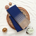 Blue and beige striped saree detail showcasing woven texture and elegant striped pattern close up