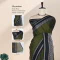 An olive green saree with a black and silver patterned border, with head, blouse, and pallu