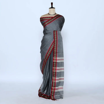 A gray cotton saree with red and gold borders best for daily wear