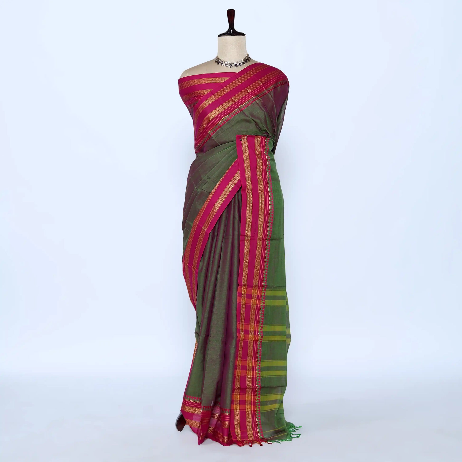 Green and magenta saree with gold striped border 