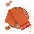 Kanchi Cotton Saree With Maroon Zari Border In Yellow Folded Display View With Decorative Accents
