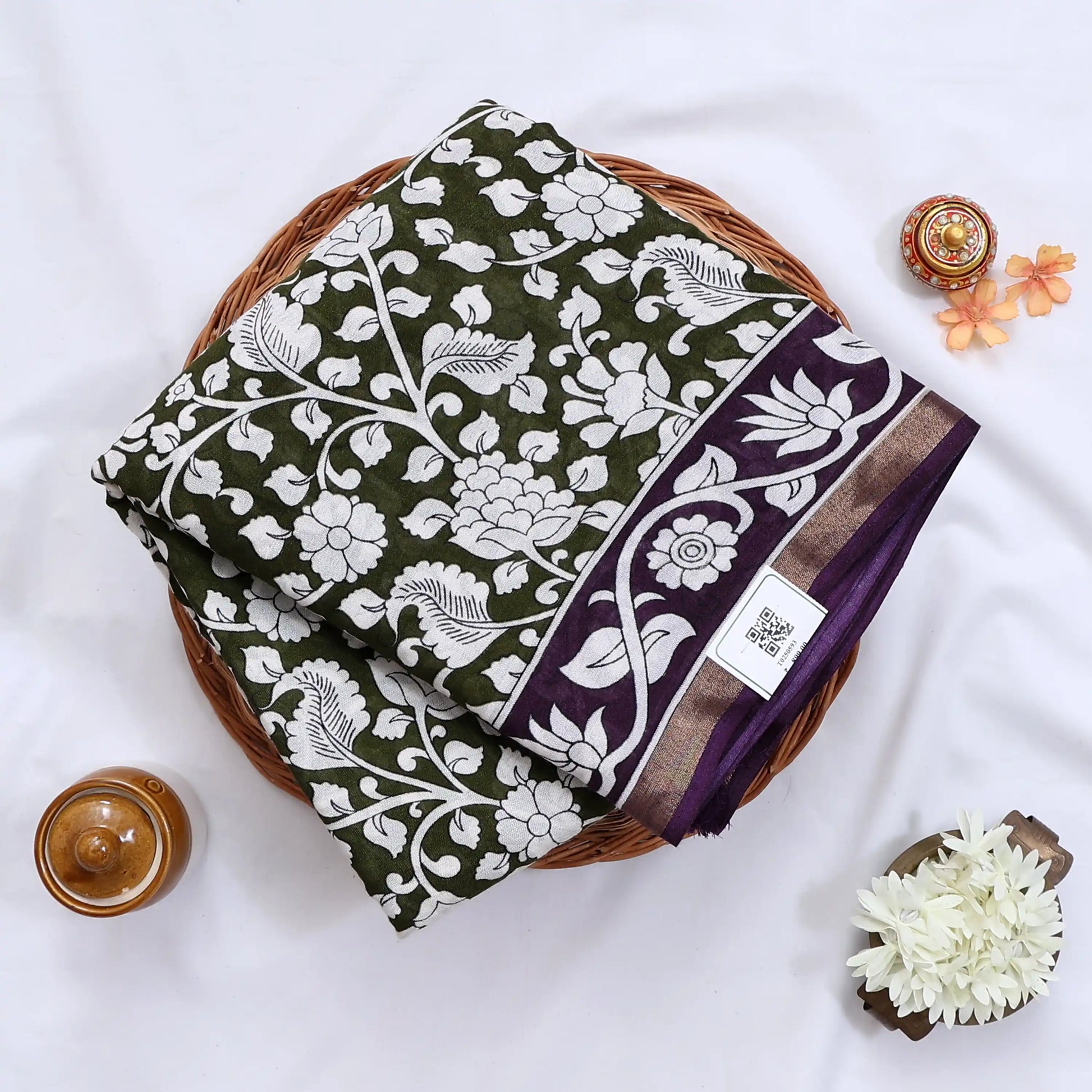 Semi Chanderi saree with white floral print olive green body and purple border folded top view