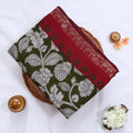 Semi Chanderi saree with floral print maroon peacock zari border olive green body folded front view